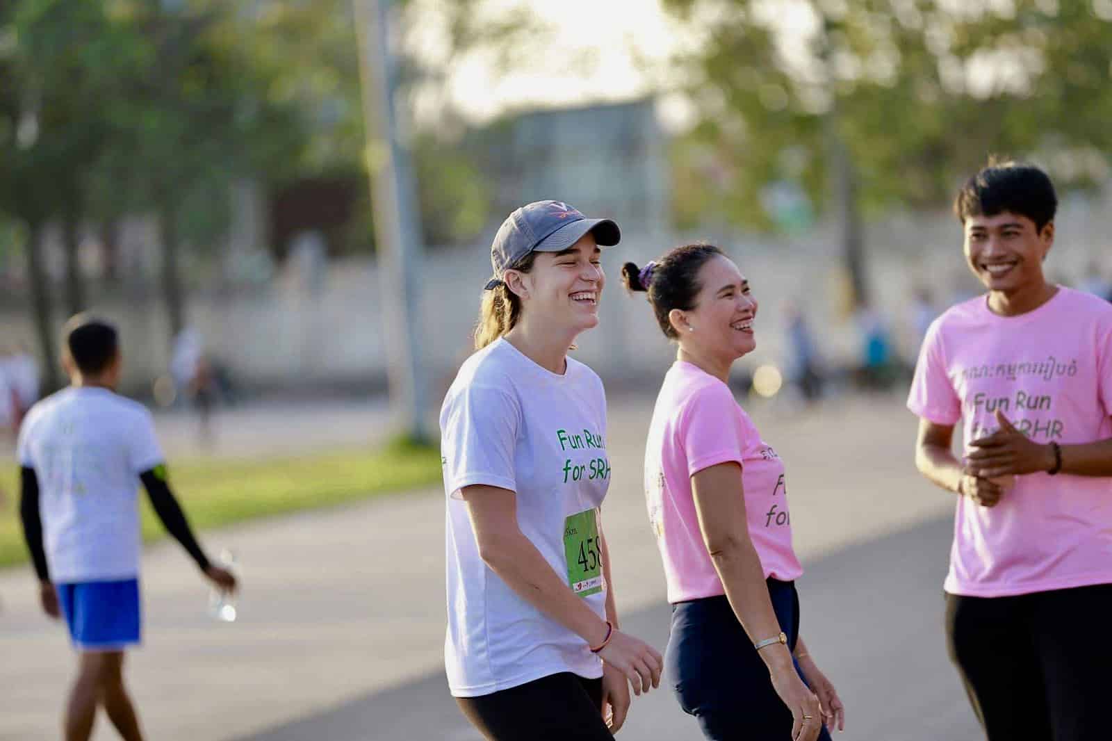 Maddie having a laugh with RHAC colleagues at a Fun Run for Sexual and Reproductive Health and Rights (SRHR).