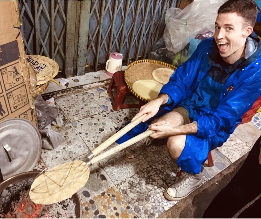 Andrew attempting to make his favorite snack, banh chuoi or banana rice paper. He burnt it.