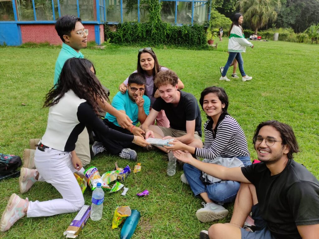 Evan with his workshop participants celebrating the release of their anthology, followed by a hike in Godawari.